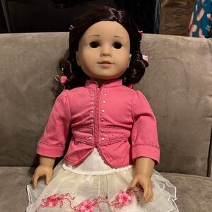American Girl Doll with Pink Jacket and Cream Skirt